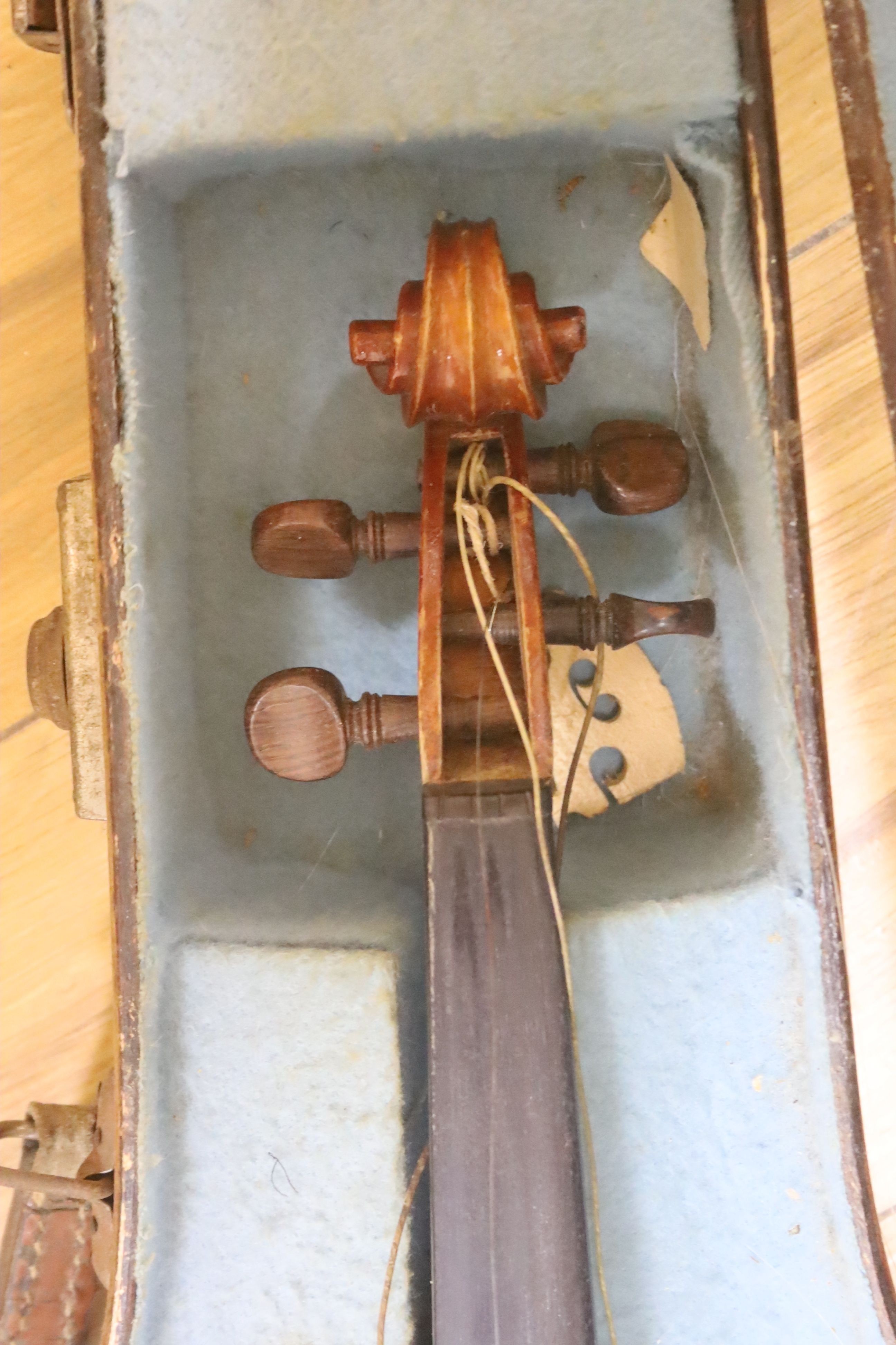 A Stradivarius copy violin and two bows and another bow, both cased, backs 33cm and 30cm